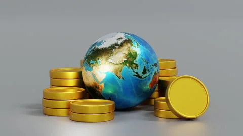 Planet earth and stack of coin, concept of global business Stock Footage 247429424
