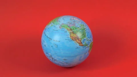 Planet Earth globe is spinning on the red background. Earth model. Stock-Footage 130820722