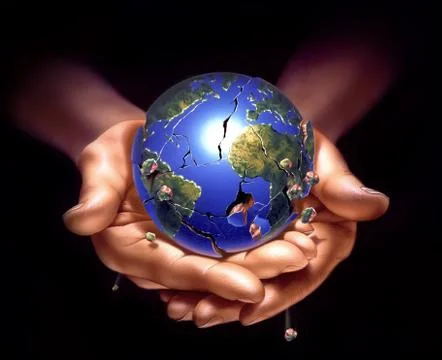 Planet earth on human hands, breaking down and crampling, with fragments fall Stock Photos