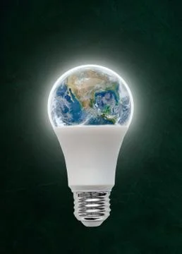 Planet Earth Inside LED Light Bulb With Copy Space Stock Photos