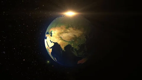 Planet earth rotating light rays Stock Footage 99077369