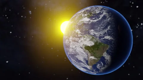 Planet earth rotating with the sun in the background. the earth lit by the sun Video stock 264866663