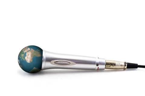 Planet earth in a silver microphone Stock Photos