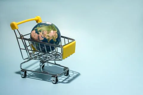 Planet earth in supermarket trolley, online shopping. Concepth photo of Earth Stock Photos