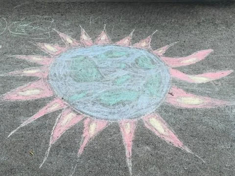 Planet Earth Surrounded by Sun Rays Chalk Drawing, Stock Photos