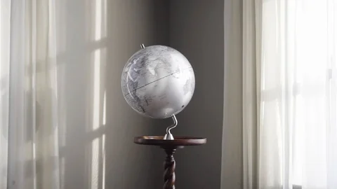 Planet globe on table earth spinning with sunshine Video stock 128334660