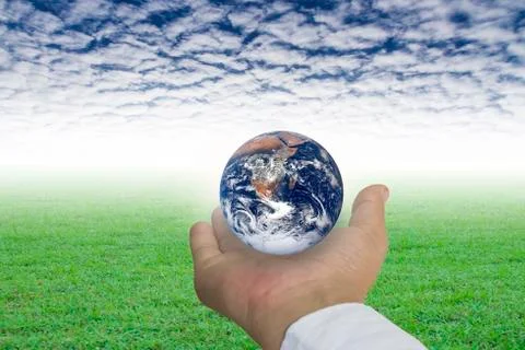 Planet in human hand Stock Photos