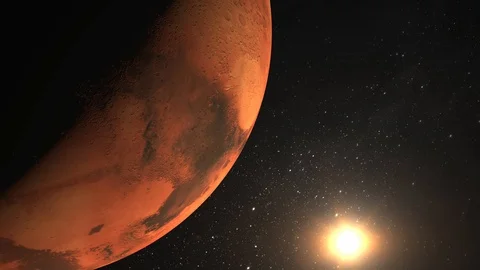 Planet Mars. The camera flies around the Mars. The sun is in the frame. View Video stock 99251187