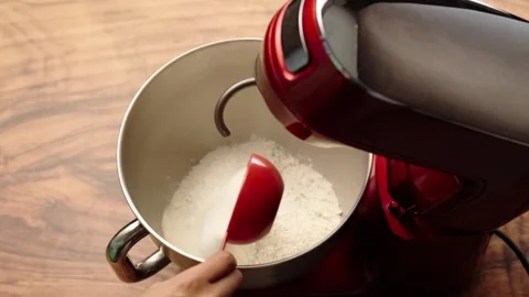 Planetary mixer, adding sugar with a red measuring cup Stock Footage 281459821