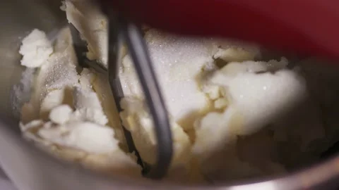 Planetary mixer begins to work, blades begin to rotate and beat the white cream Stock Footage 147866996