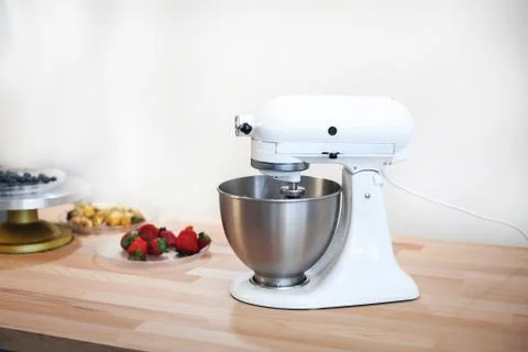 Planetary mixer on a table with fruit on a white background Stock Photos