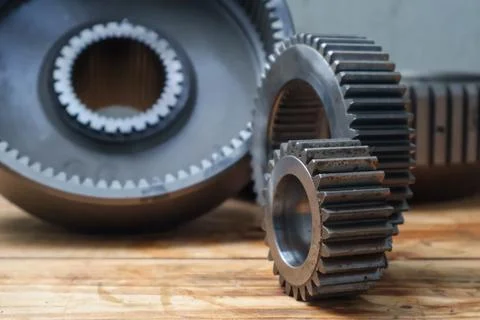 Planetary Sun Gear and Ring Gear on Wooden Workshop Table. Stock Photos
