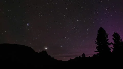Planets aligning over mountain landscape at night Video stock 300989093