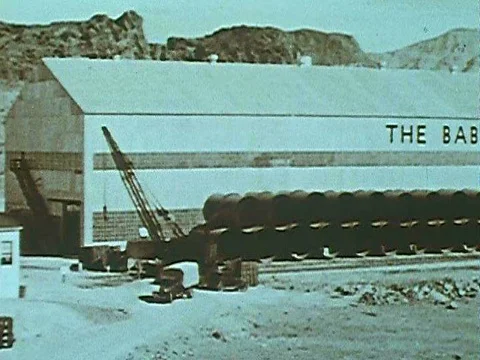 Planing machines and a vertical lathe are used in a steel fabrication plant to Stock Footage