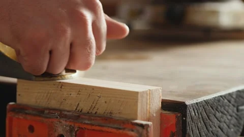 Planing pine planks with a hand planer Stock Footage 154253580