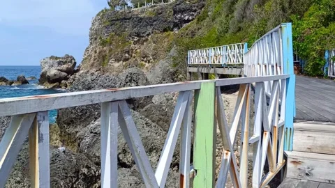 A plank bridge built between the rocks Stock Footage 297136656