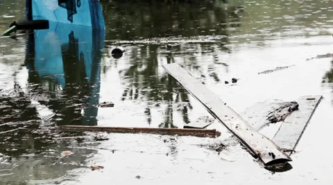 Plank floating on the surface of the lake after the storm. Flooding village. Stock Footage 37353210