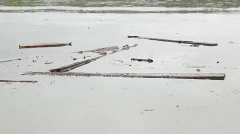 Plank floating on the surface of the lake after the storm. Flooding village. Stock Footage 37364757
