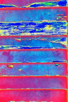 Plank wall with peeling paint, changed colors, colorful background Stock Photos