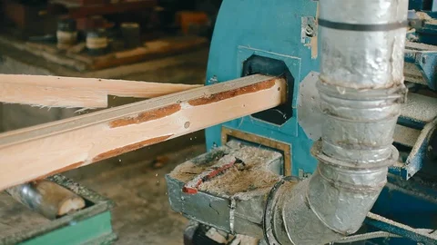 Planks come out of the woodworking machine Stock Footage 129236969