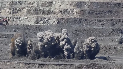 Planned blast in an iron ore quarry in Ukraine Stock Footage