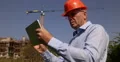 Planner Engineer Using Tablet Building Site Check Architect Electronic Plans 4k or 4k+ Resolution