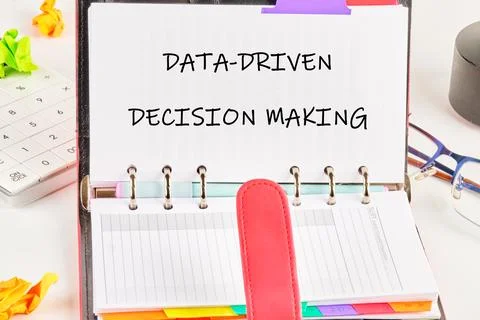 A planner open to a page titled Data-Driven Decision Making displays colorful Foto stock