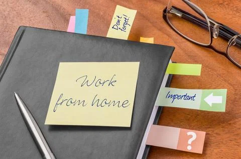 Planner with sticky note - Work from home Stock Photos