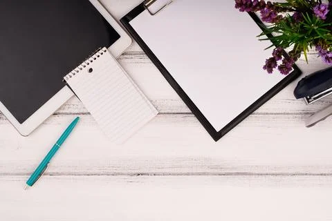 Planner on the wooden working table with computer. Blank white paper on working Stock Photos