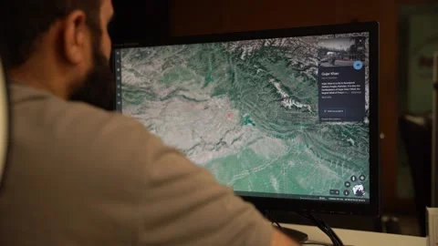Planning and looking at Google Earth 3D aerial view desktop app to explore Stock Footage 237409985