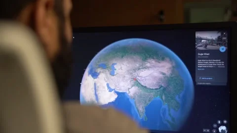 Planning and looking at Google Earth 3D aerial view desktop app to explore Stock Footage 237410006