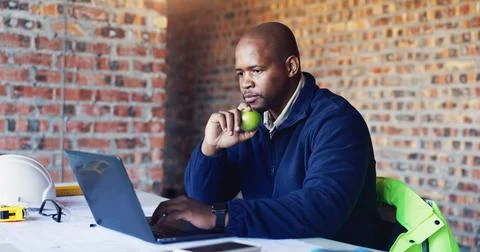 Planning, black man and architect in office with laptop for project, bluepr.. Fotos Stock