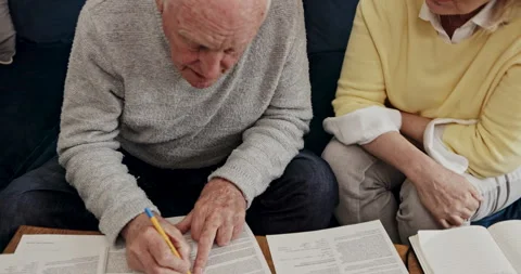 Planning, budget and documents with old couple on sofa for payment, taxes and Stock Footage 307928893