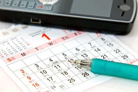 Planning on calender Stock Photos