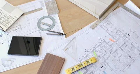 Planning construction project, architectural blueprints with tablet, compass, Stock Footage 299776376