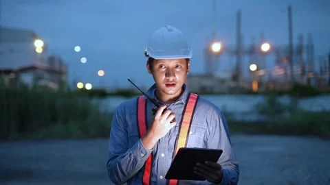 Planning Engineering with Hard Hat and Walkie-Talkie working on site Industrial. 動画素材 279505369