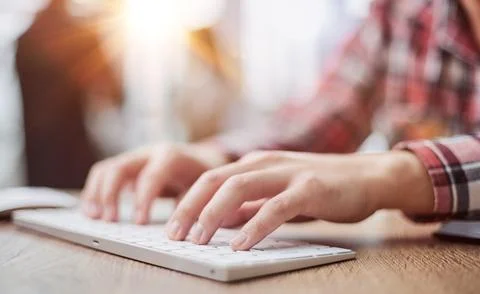 Planning his work process, taking notes and using laptop. cropped image Foto stock