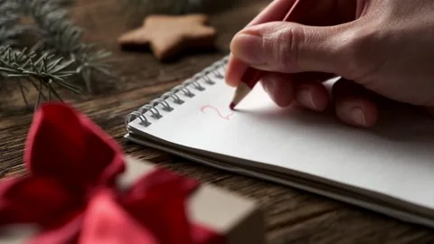 Planning for the new year 2022. Hands of young woman writing Stock Footage 167143532