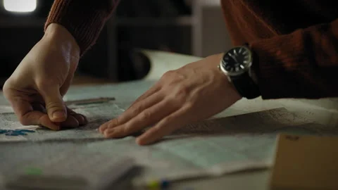 Planning a route with a map and markers in an indoor setting Stock Footage 323872820