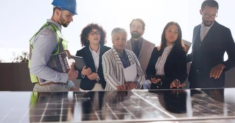 Planning, solar panel and engineer with business people outdoor for photovoltaic Foto stock