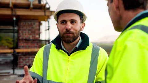 Planning, team or architect with feedback at construction site, engineering Stock Footage 336202831