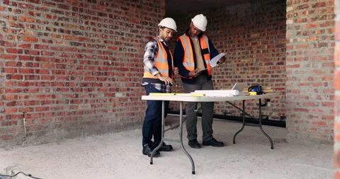 Planning, team or engineer with clipboard for construction, talk or Stock Footage 336222458