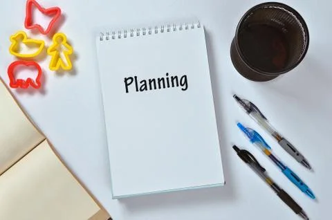 Planning text on notepad with office accessories. Business motivation, inspir Stock Photos