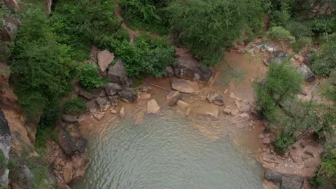 Plano aereo de arroyo a cascada y rio Stock Footage 134642009