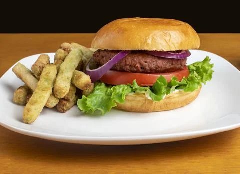 Plant base burger with a side of broccoli fries Stock Photos