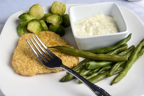 Plant based  fish served with brussel sprout and green beans, Stock Photos