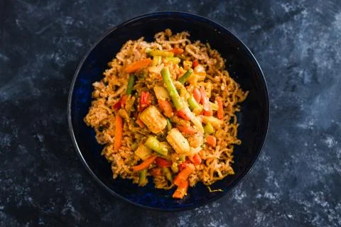 Plant-based food, vegan ginger noodls with stir fried veggies in green curry  Stock Photos