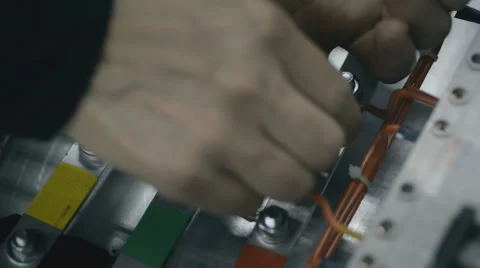 Plant electrician builder engineers at work installing cable hand  tighten the Stock Footage 57522588