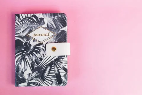 A plant pattern notebook on a pink background. Journaling. studying concept. Stock Photos
