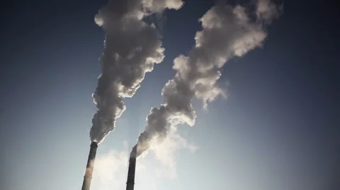 Plant pipe with smoke against blue sky Stock Footage 44794354